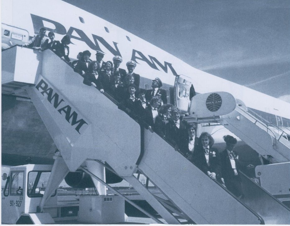 1991 A Pan Am crew assigned to a White House 'Press Charter' flight pose for a picture on the stairs with their 747 in the background.